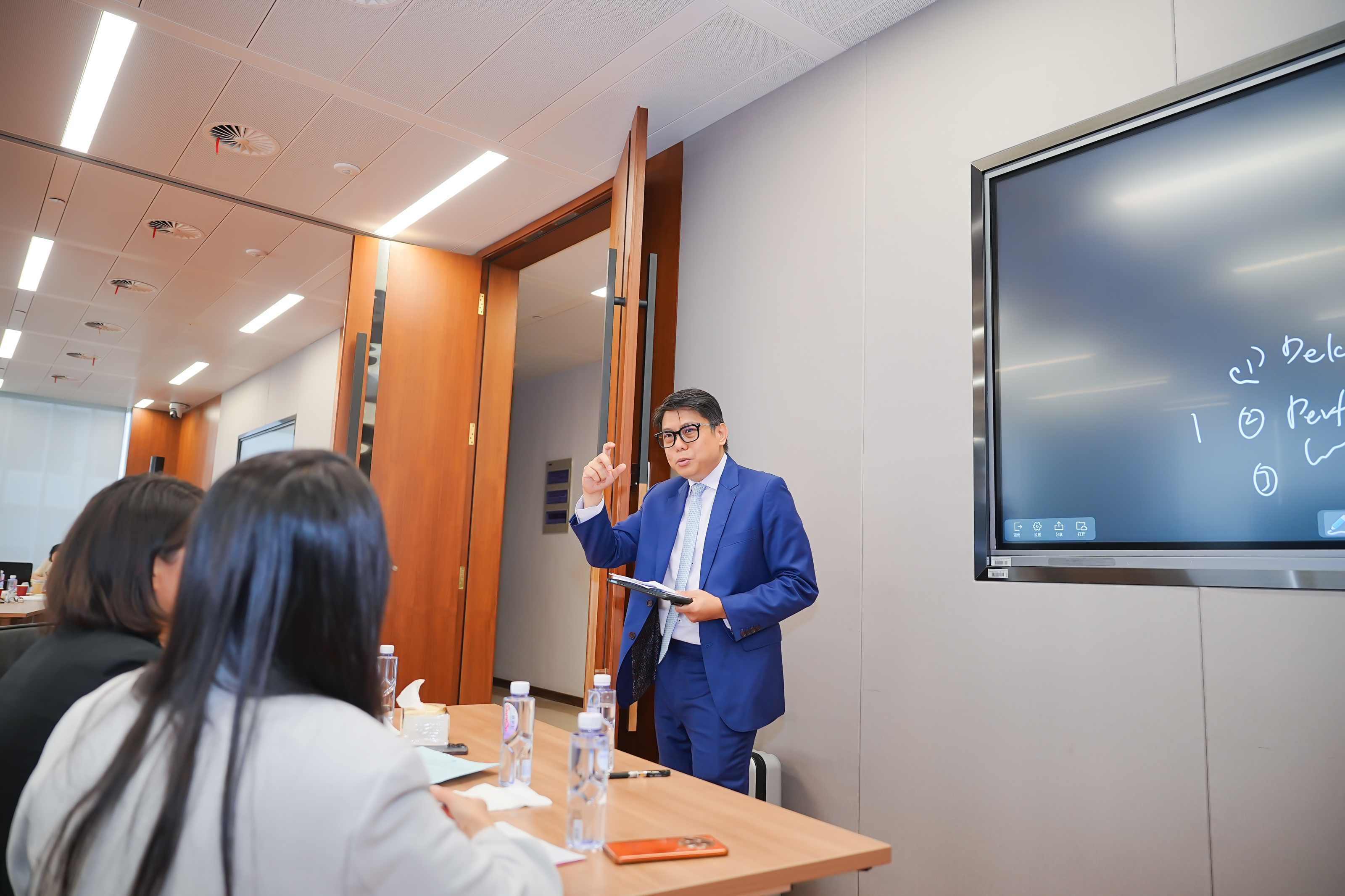 Mr See Chern Yang coaching the participants during the role-playing session.